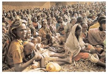 These refugees were displaced by years of warfare in their own countries. In the 1980s they came to Sudan from Ethiopia and Chad, only to find a famine awaiting them. [Photograph by Chris Rainier. Chris Rainier/Corbis-Bettmann. Reproduced by permission.]